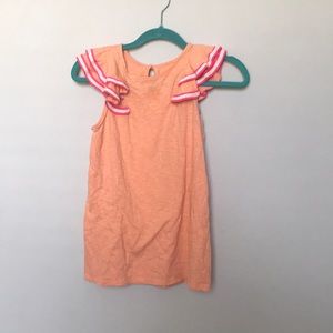 Pink shirt with the ruffles on items rope detail